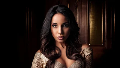 Portrait Of A Beautiful Woman In A Gold Dress