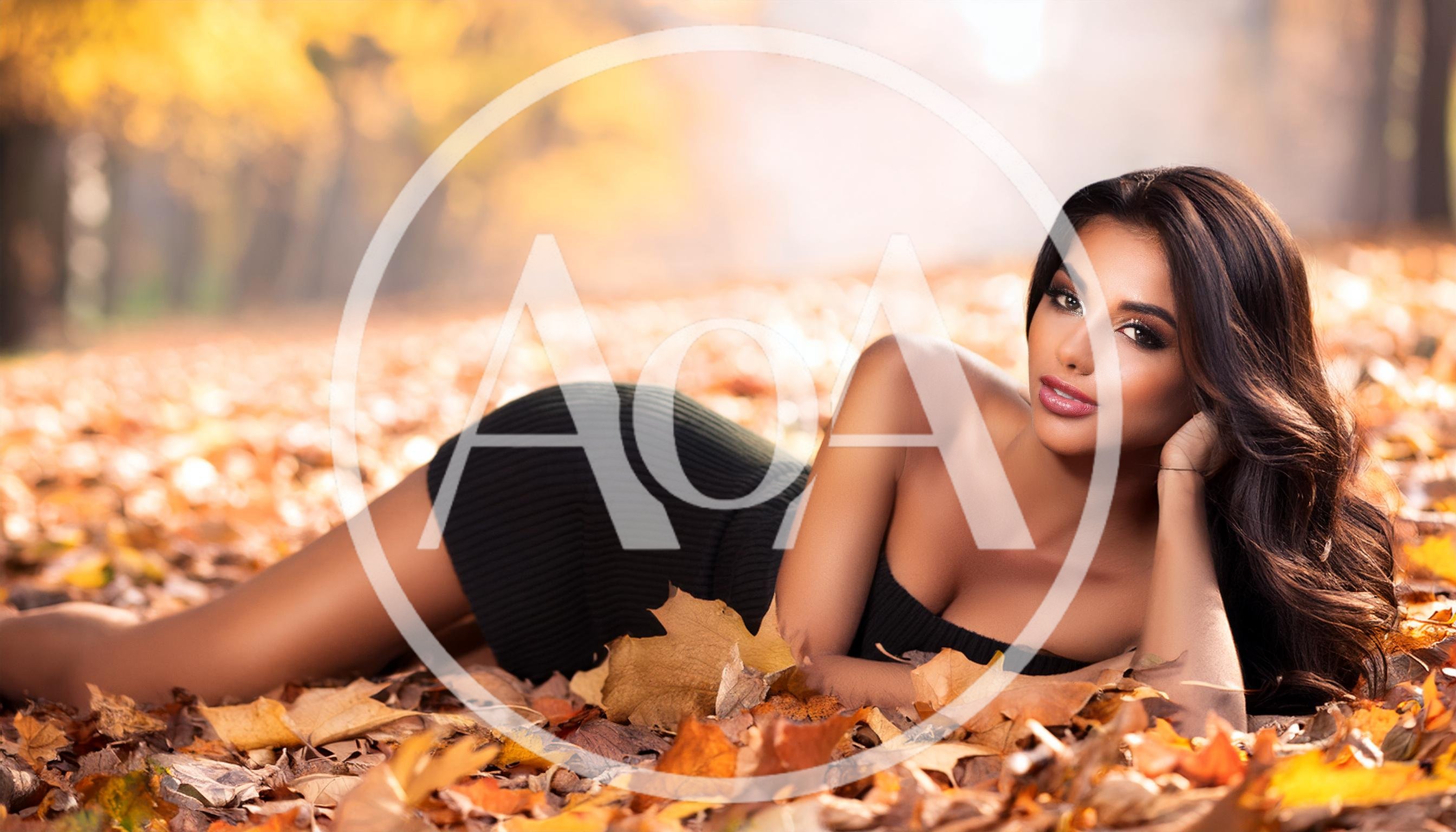 Beautiful Woman Lying In Autumn Leaves
