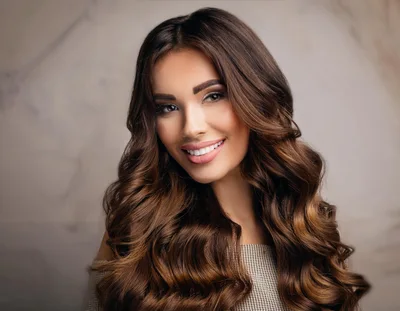 Portrait Of A Beautiful Woman With Long Wavy Hair