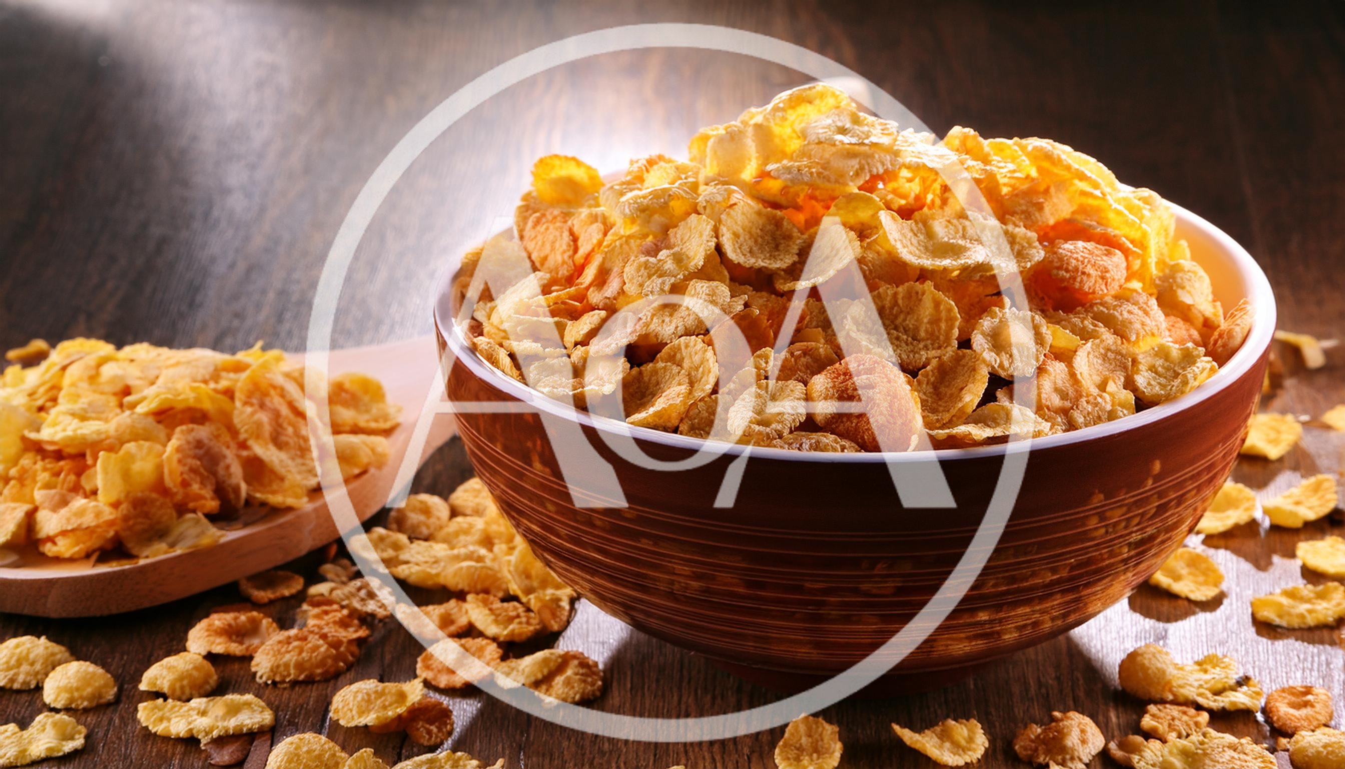 Bowl Of Crunchy Cornflakes On A Wooden Table