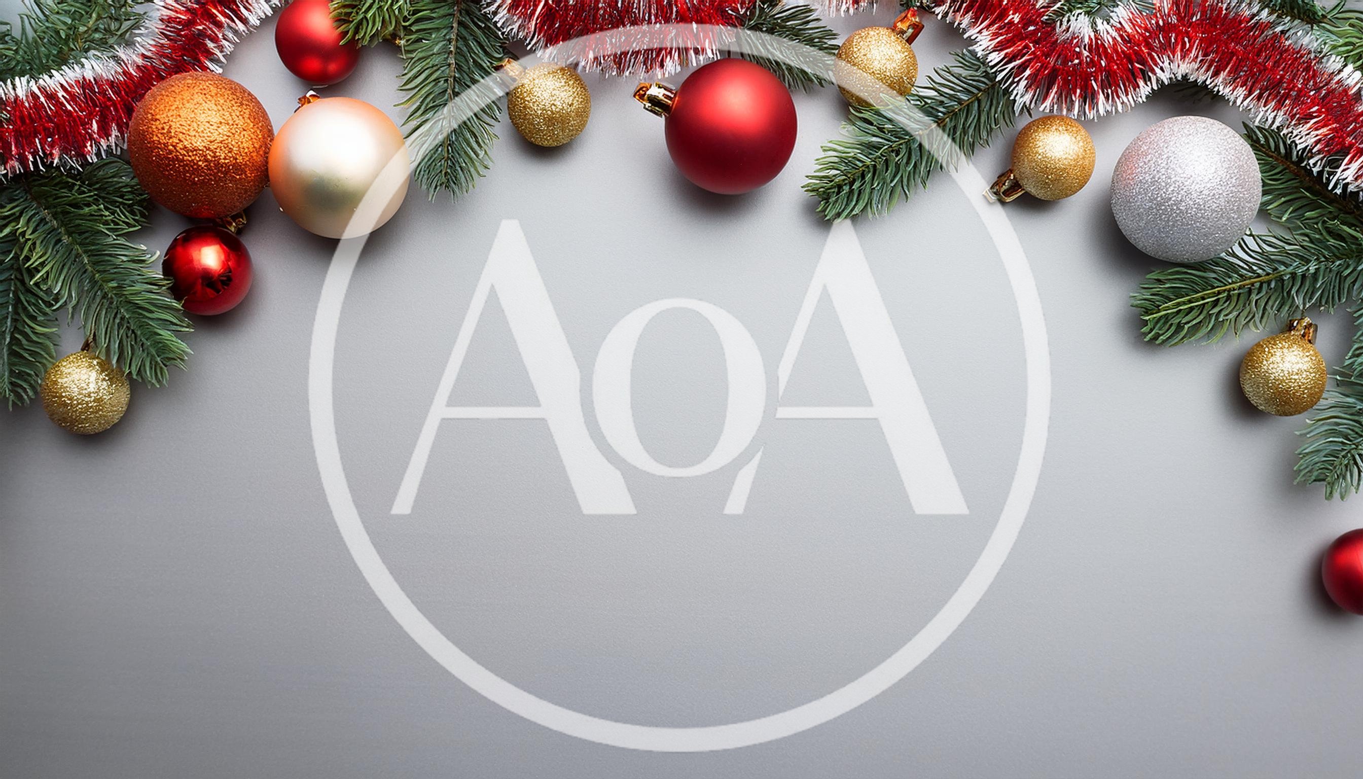 Christmas Ornaments and Pine Branches on Grey Background