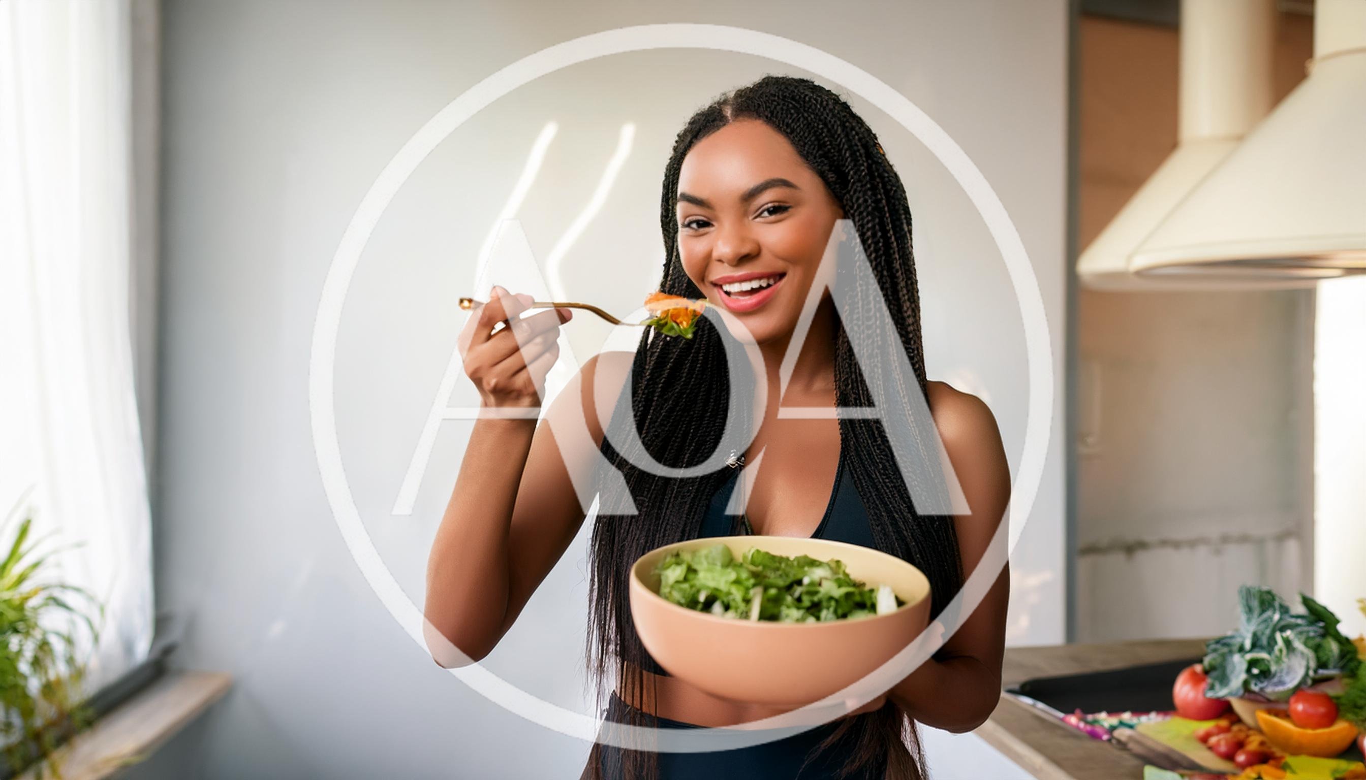 Young Woman Eating Fresh Salad In Kitchen