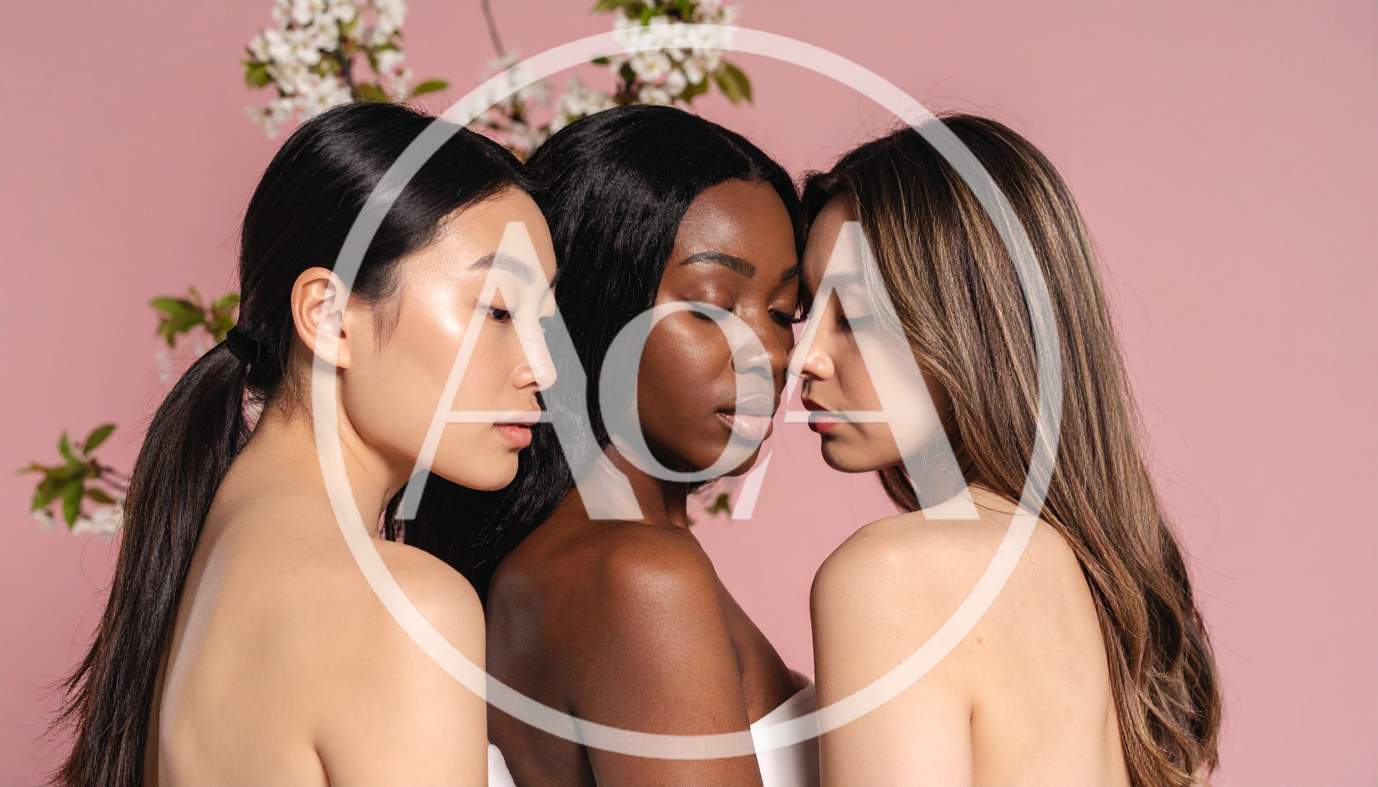 Three Diverse Women Posing Together Against Pink Background