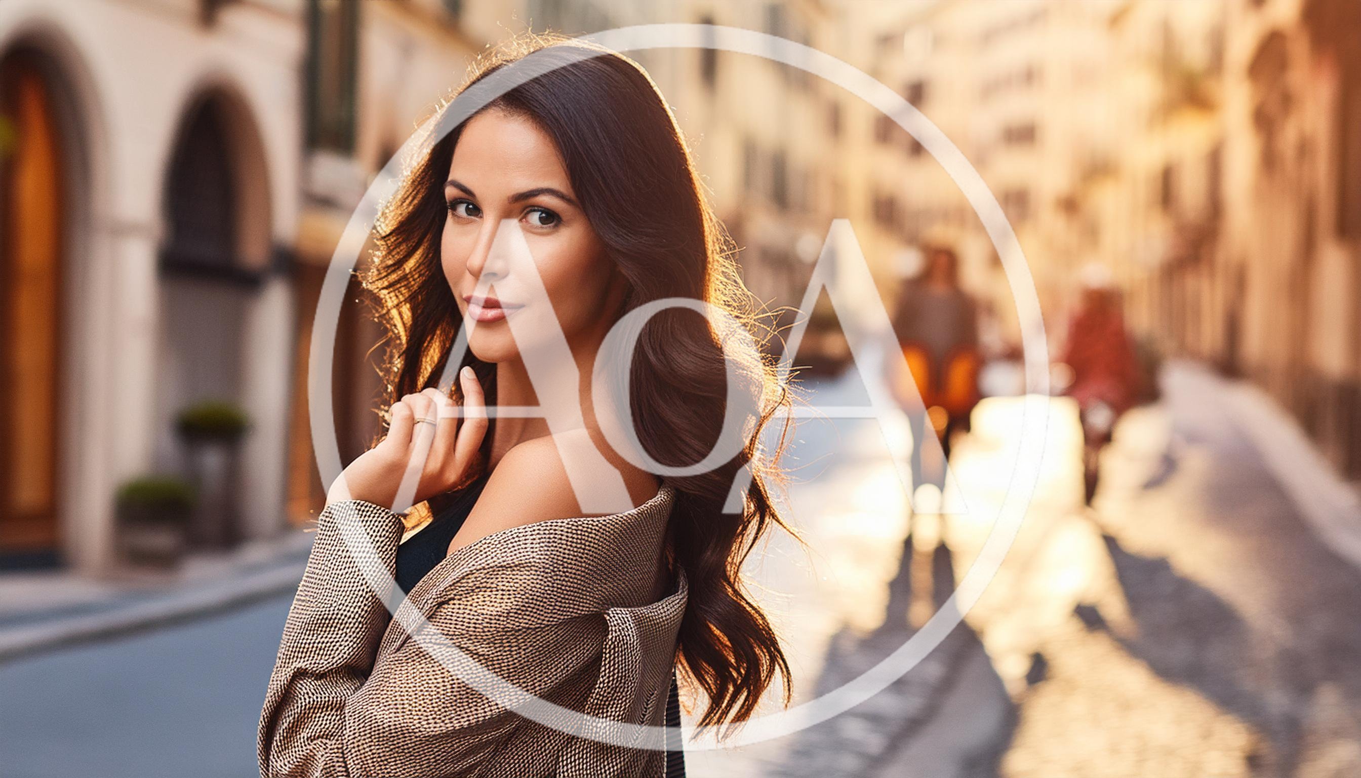 Beautiful Woman Posing In A Sunny European Street