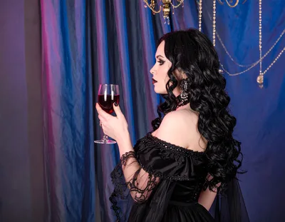 Gothic Woman Holding A Glass Of Red Wine
