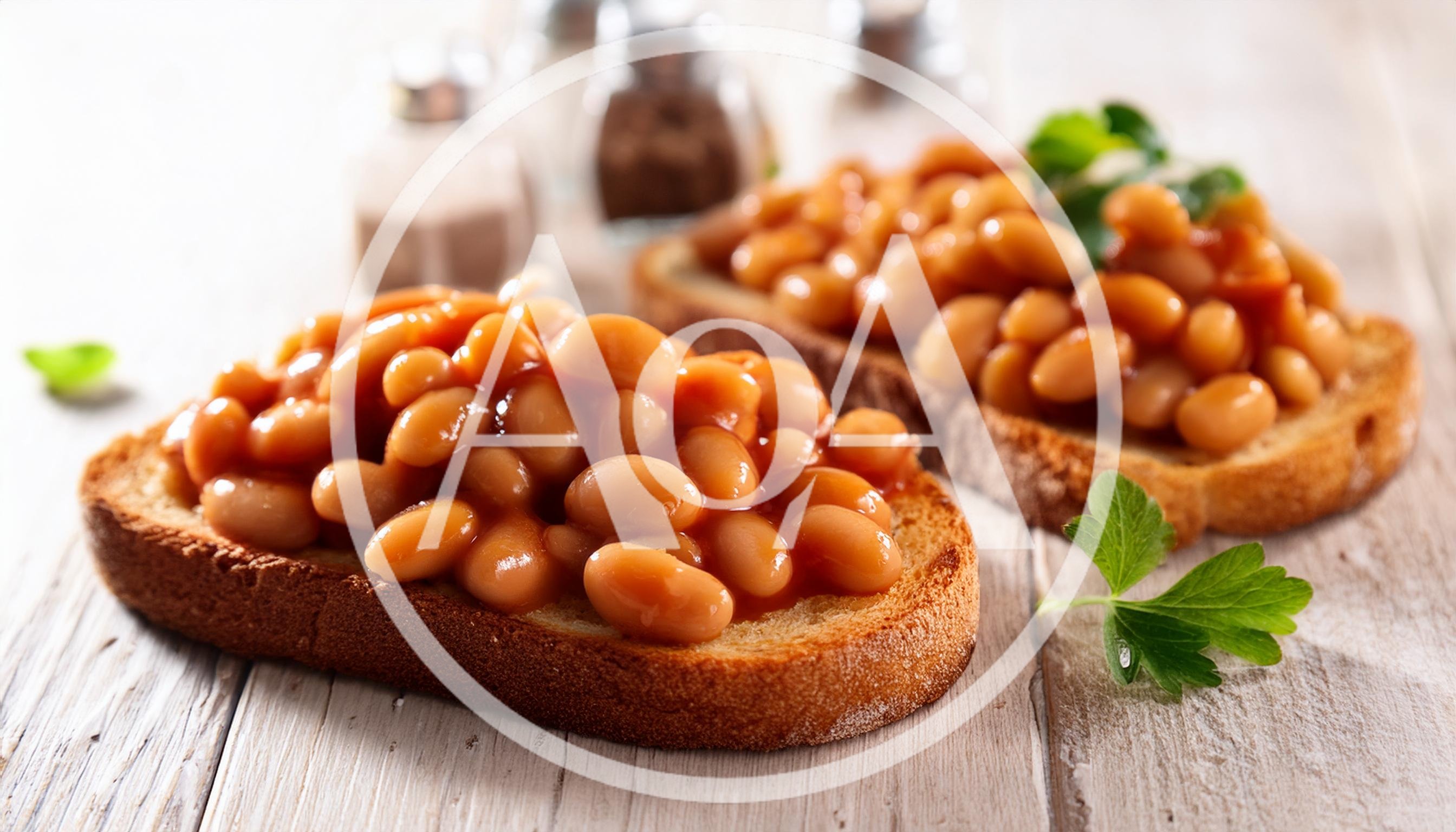 Two Slices Of Toast Topped With Baked Beans