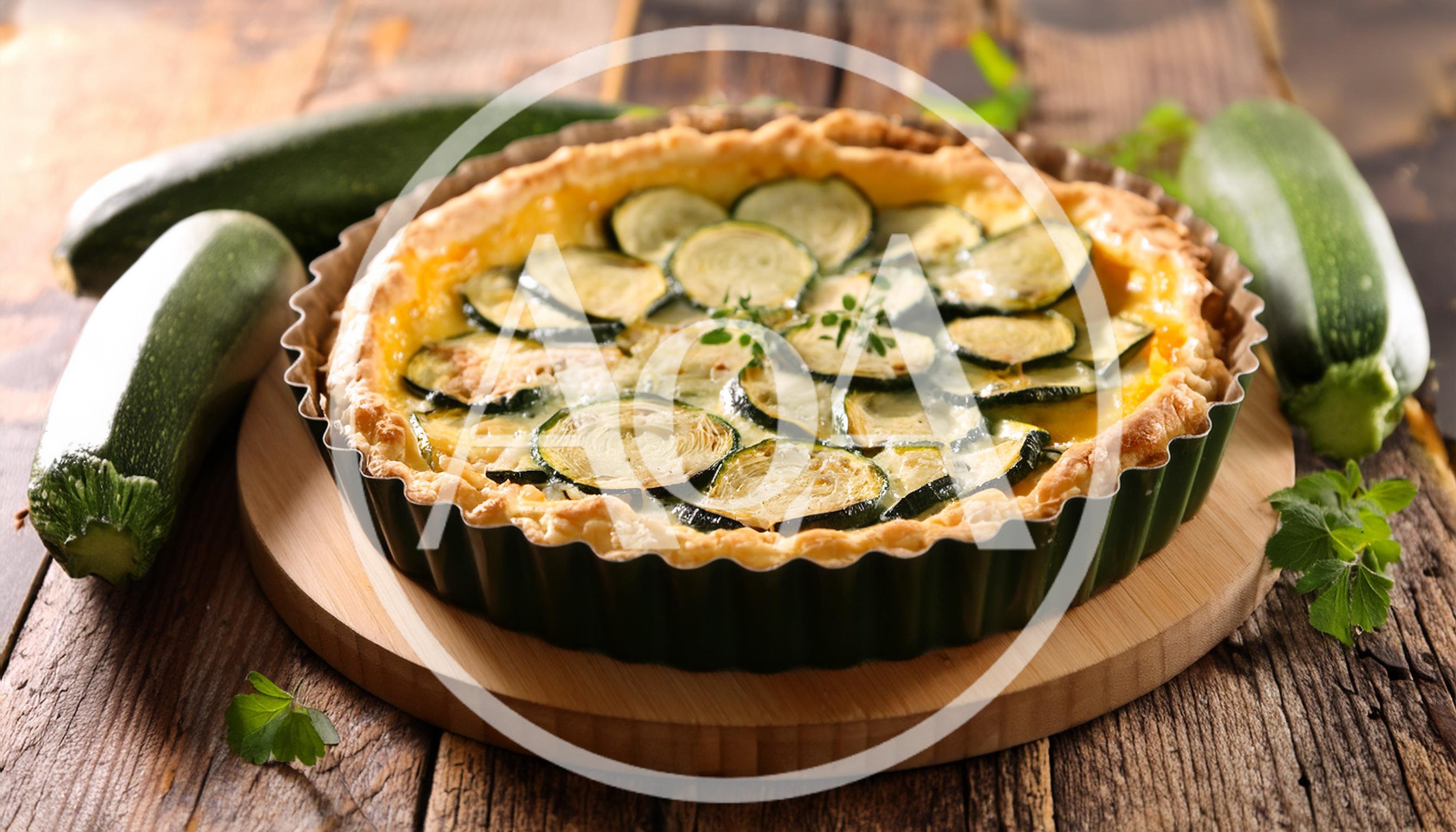 Freshly Baked Zucchini Quiche On A Wooden Board
