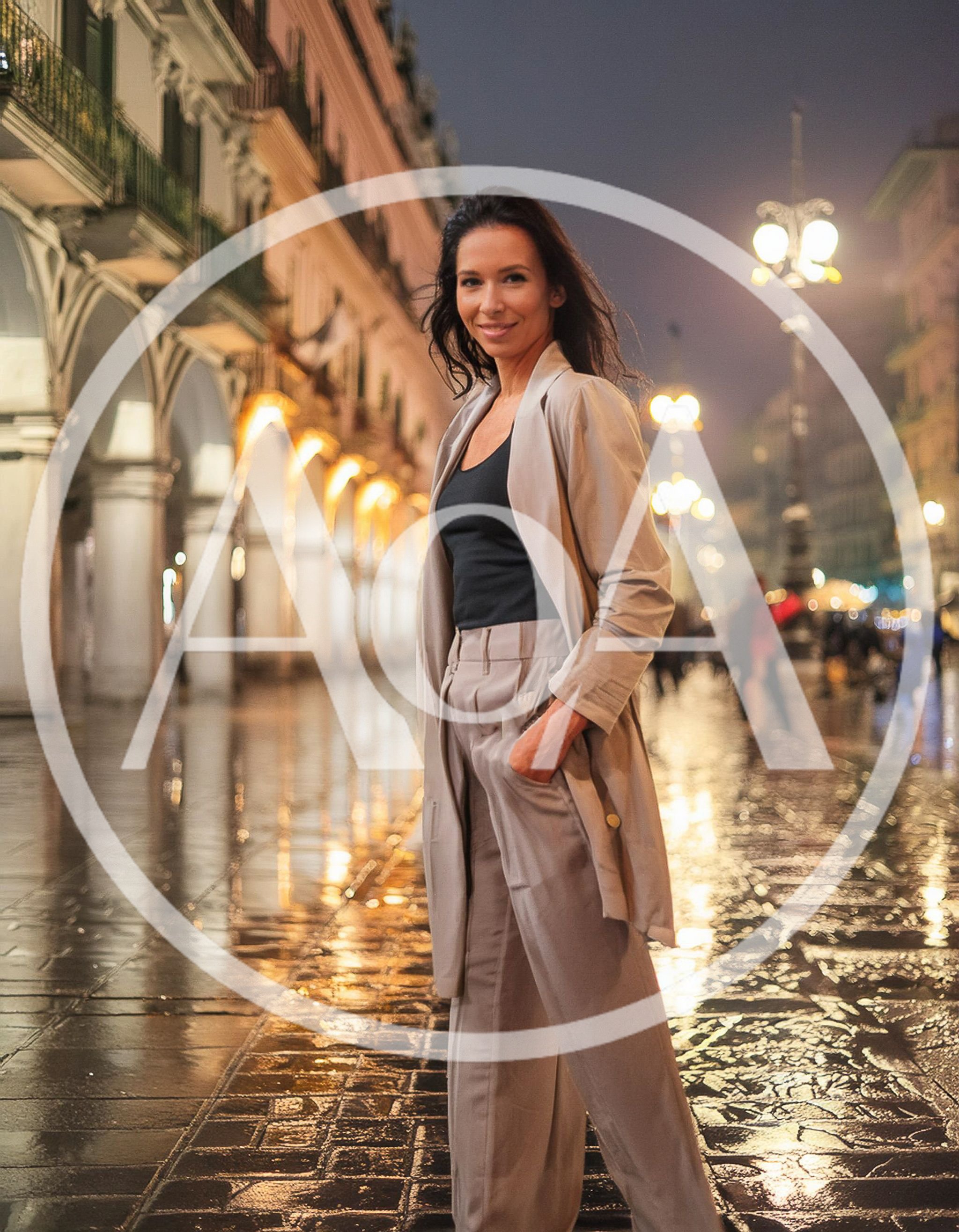 Elegant Woman Standing In A Rainy European City Square