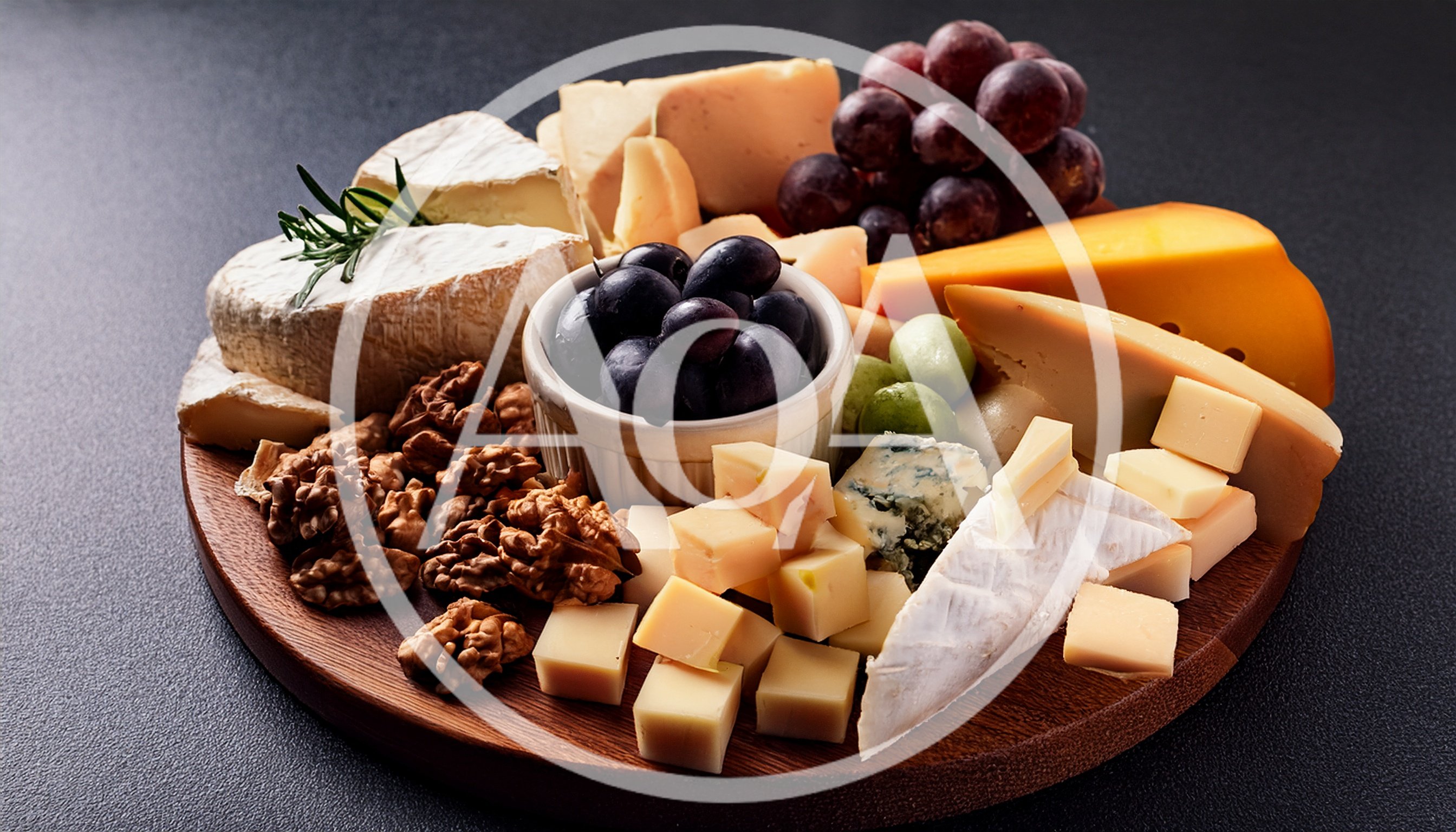Gourmet Cheese Board With Nuts And Grapes