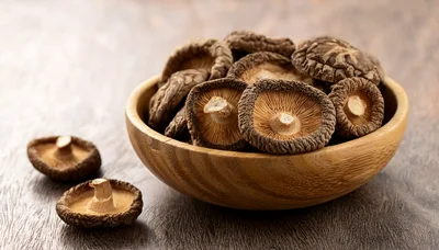 Dried Shiitake Mushrooms In A Wooden Bowl