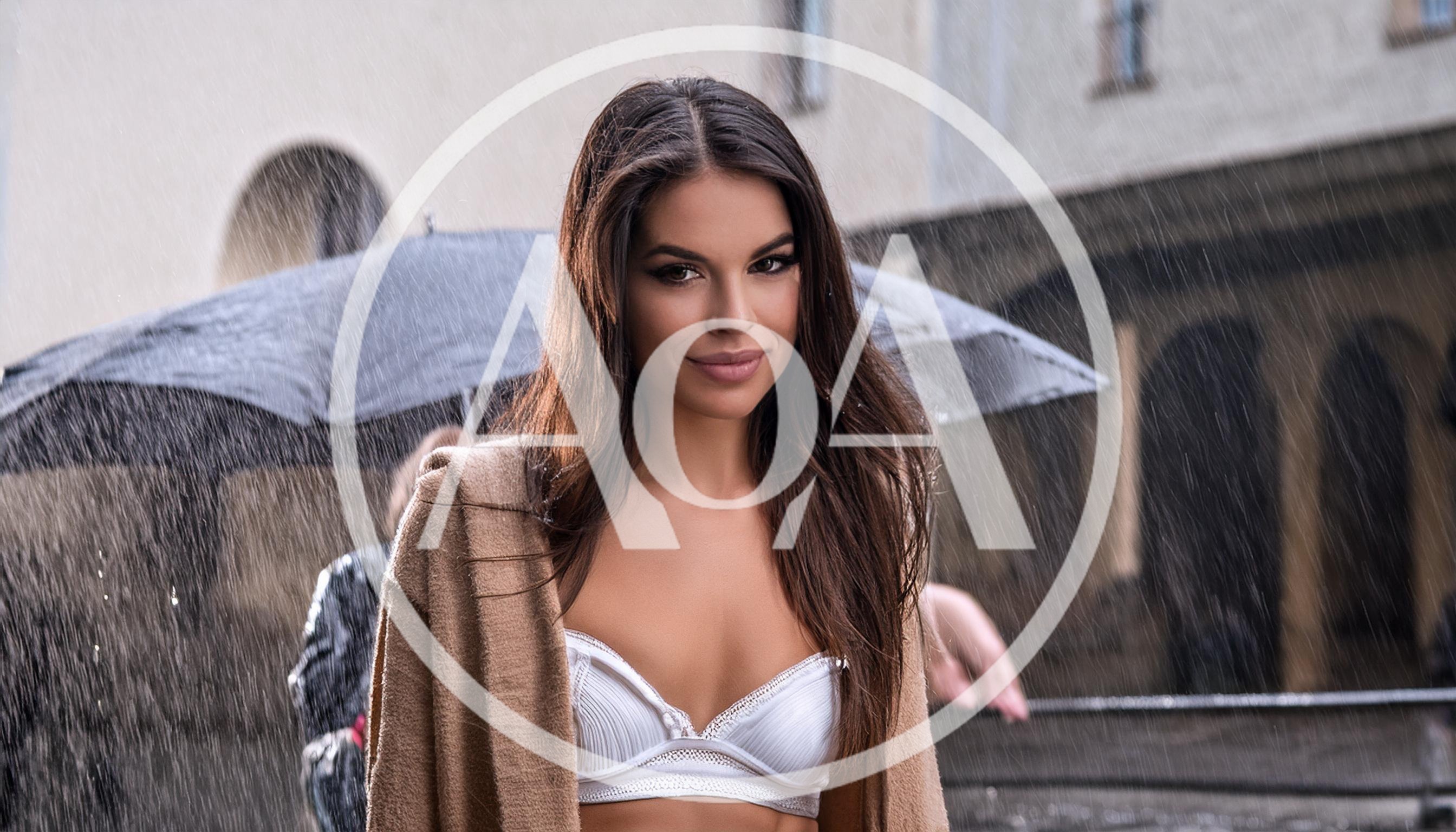 Beautiful Woman Standing Under Umbrella In The Rain