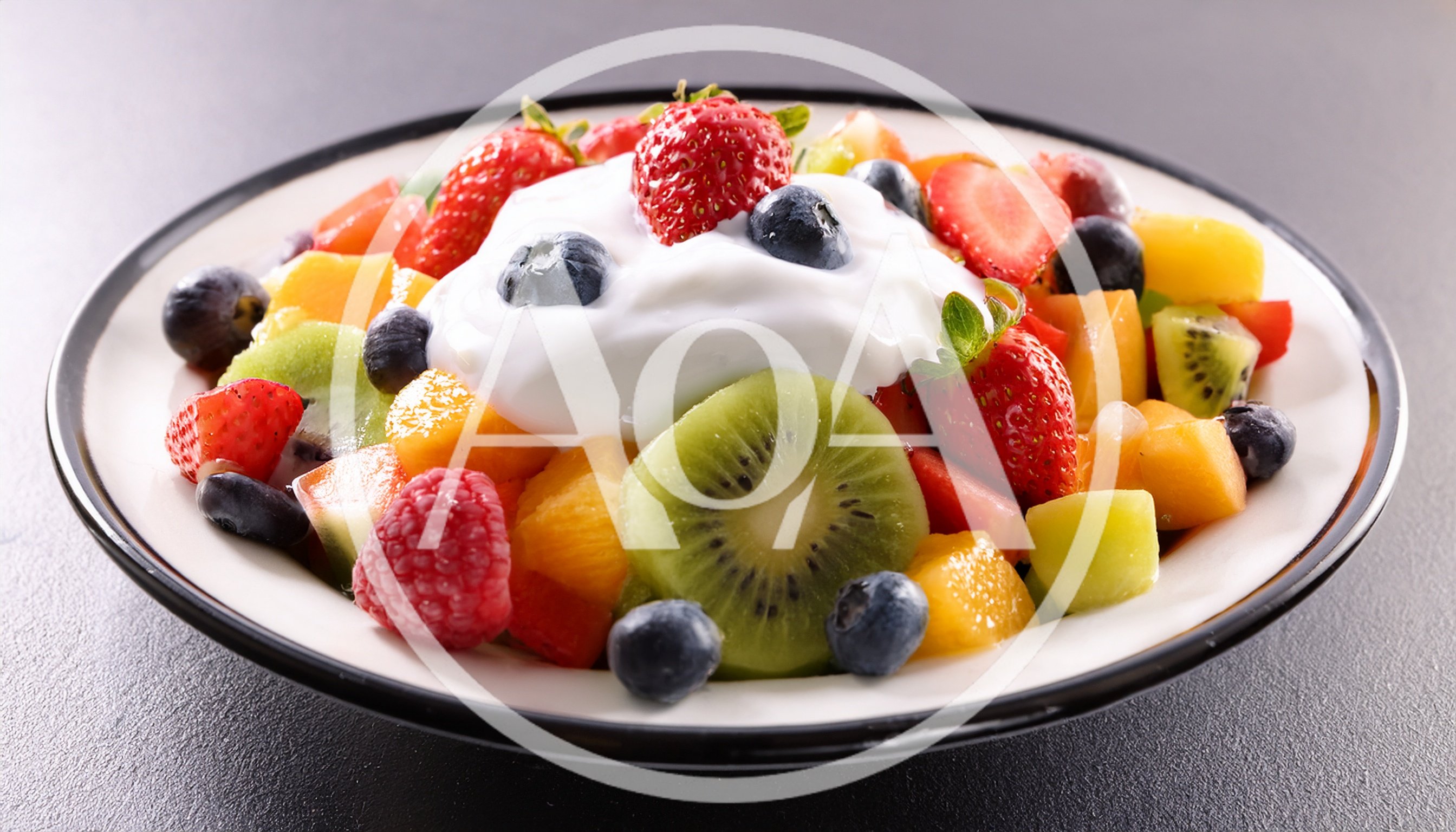 Fresh Fruit Salad Bowl With Cream Topping