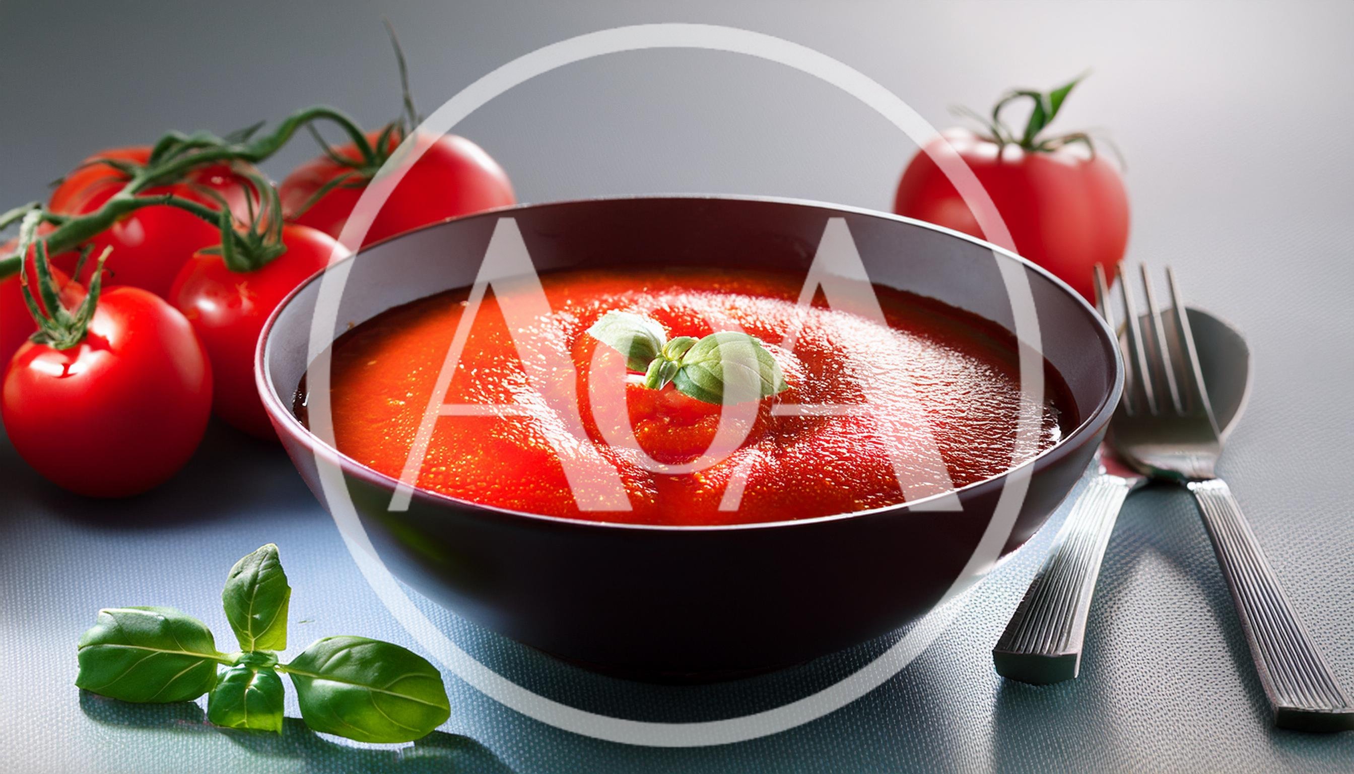 Bowl Of Tomato Soup With Fresh Basil And Tomatoes