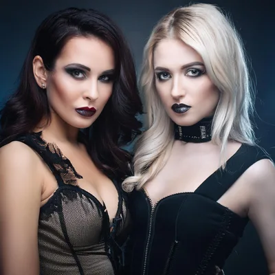 Two Fashionable Women With Dark Makeup And Corsets
