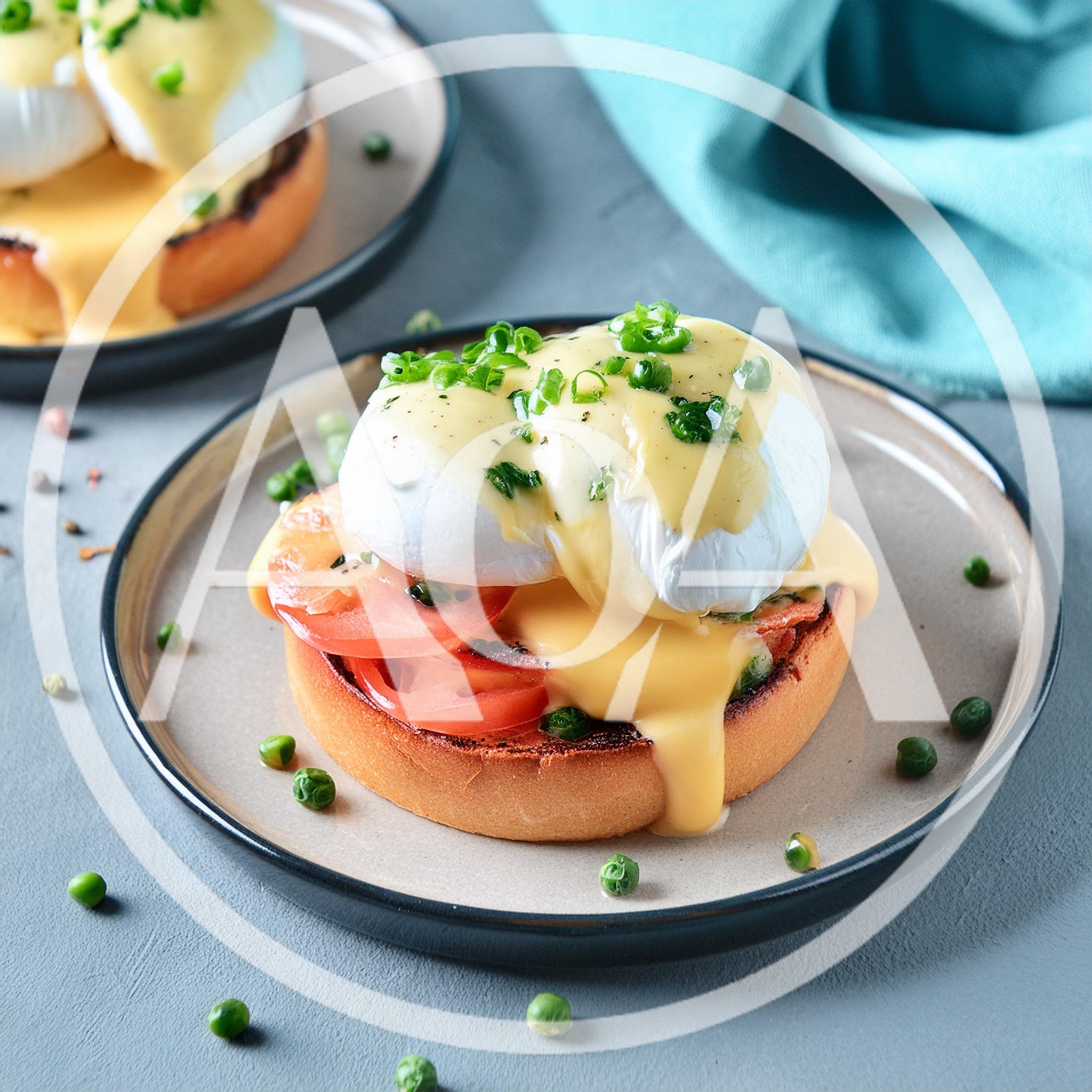 Eggs Benedict With Tomato Slices On A Plate