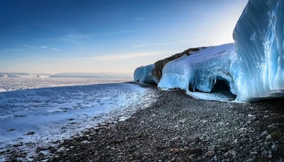 Ice Cave Formation Along A Rocky Arctic Shoreline