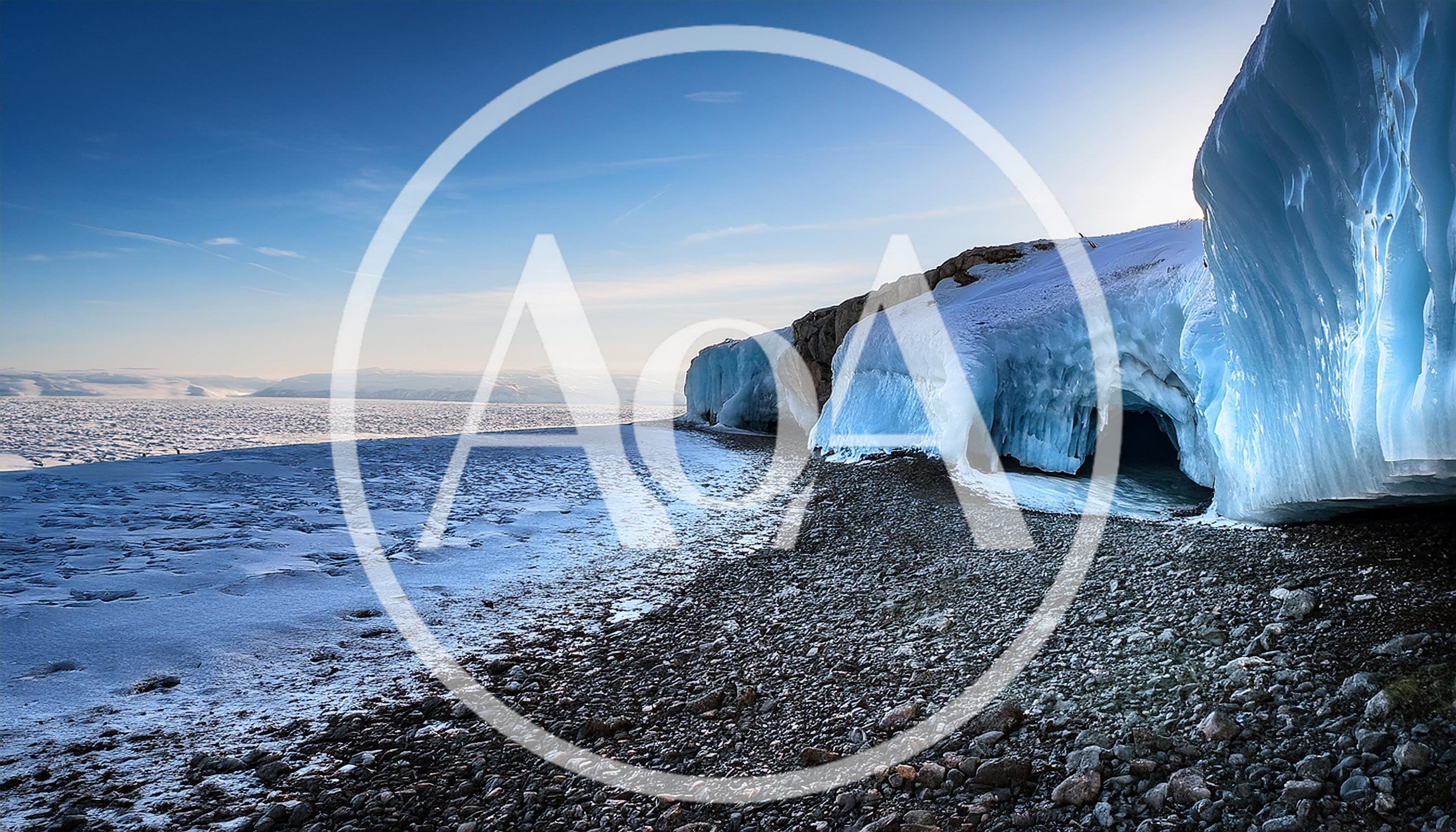Ice Cave Formation Along A Rocky Arctic Shoreline