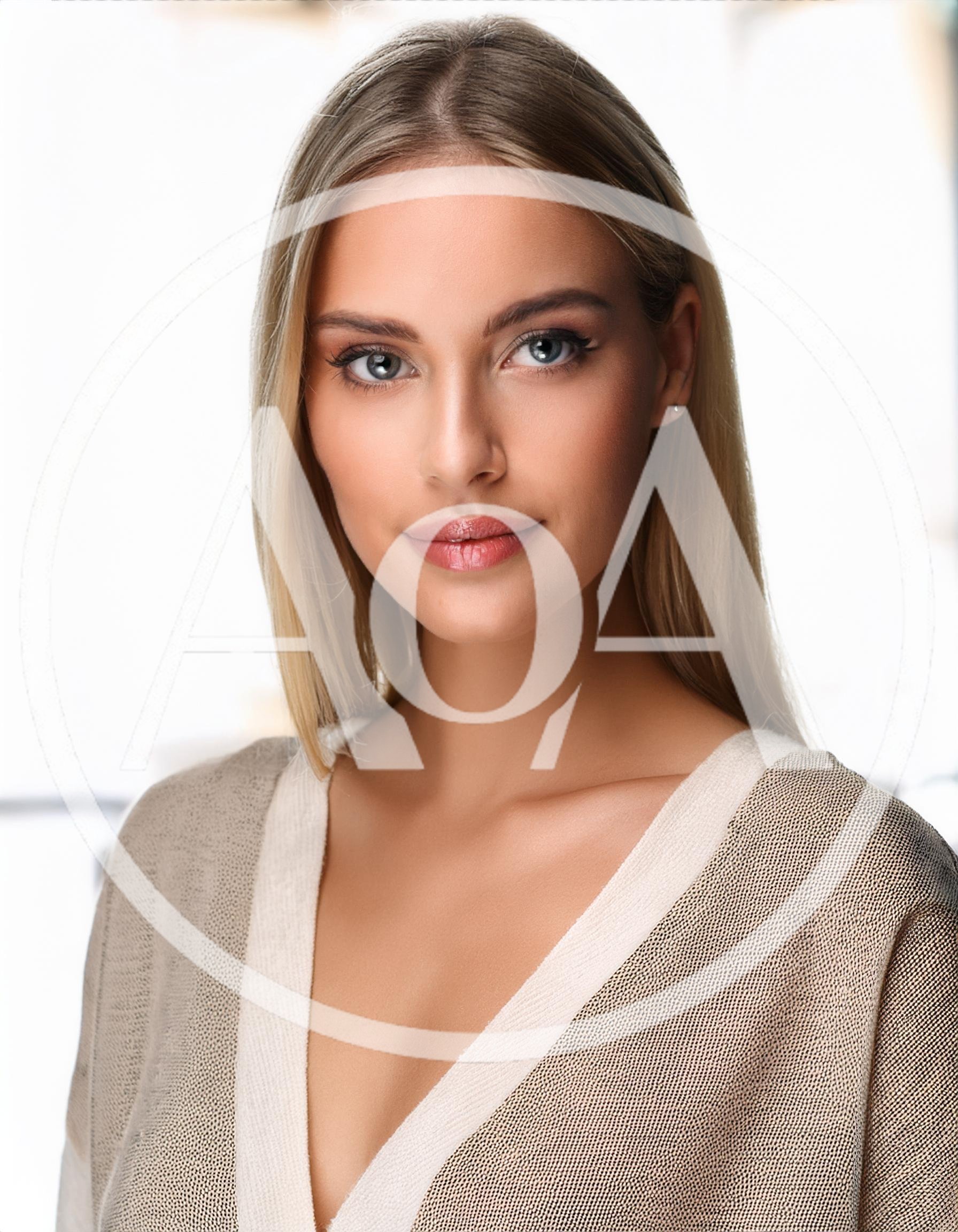 Portrait Of A Beautiful Blonde Woman Looking At Camera
