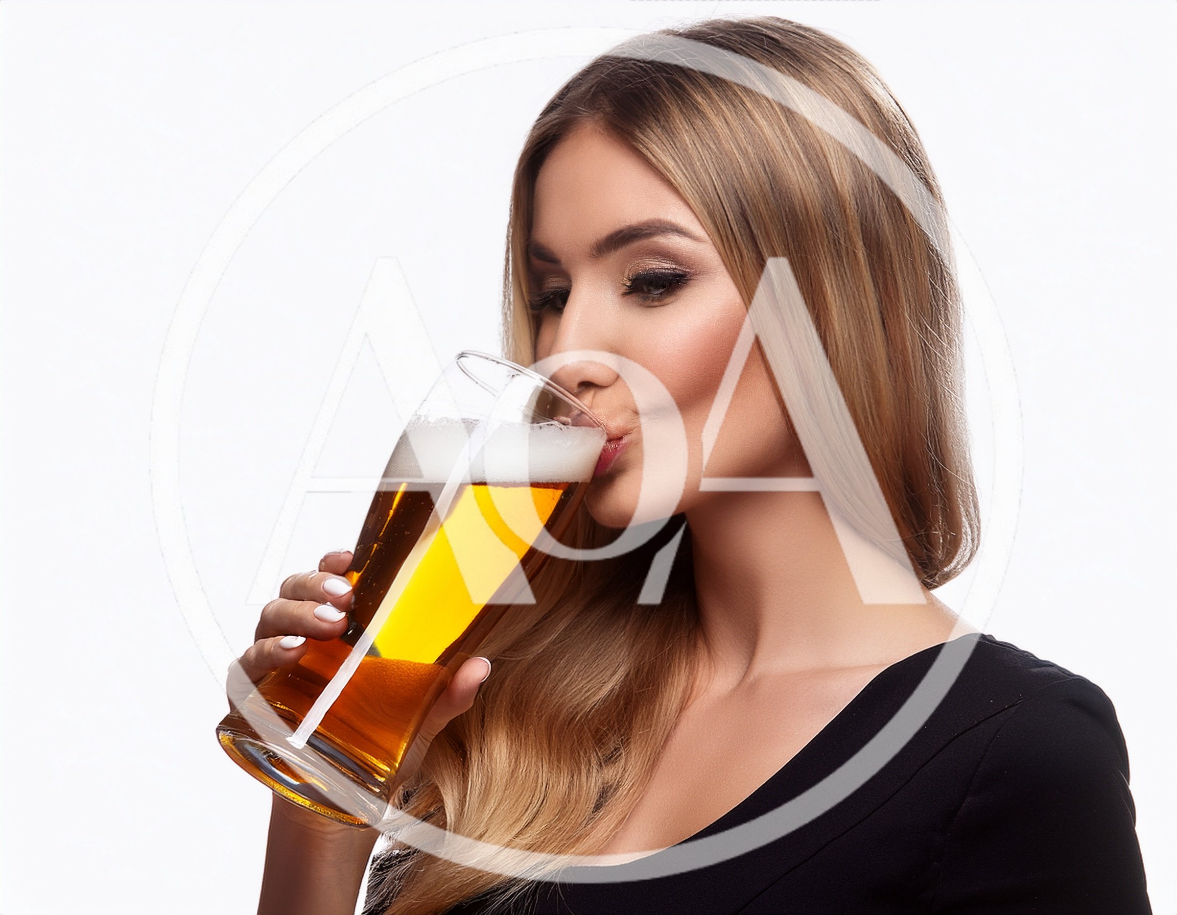 Beautiful Blonde Woman Drinking Beer From A Glass
