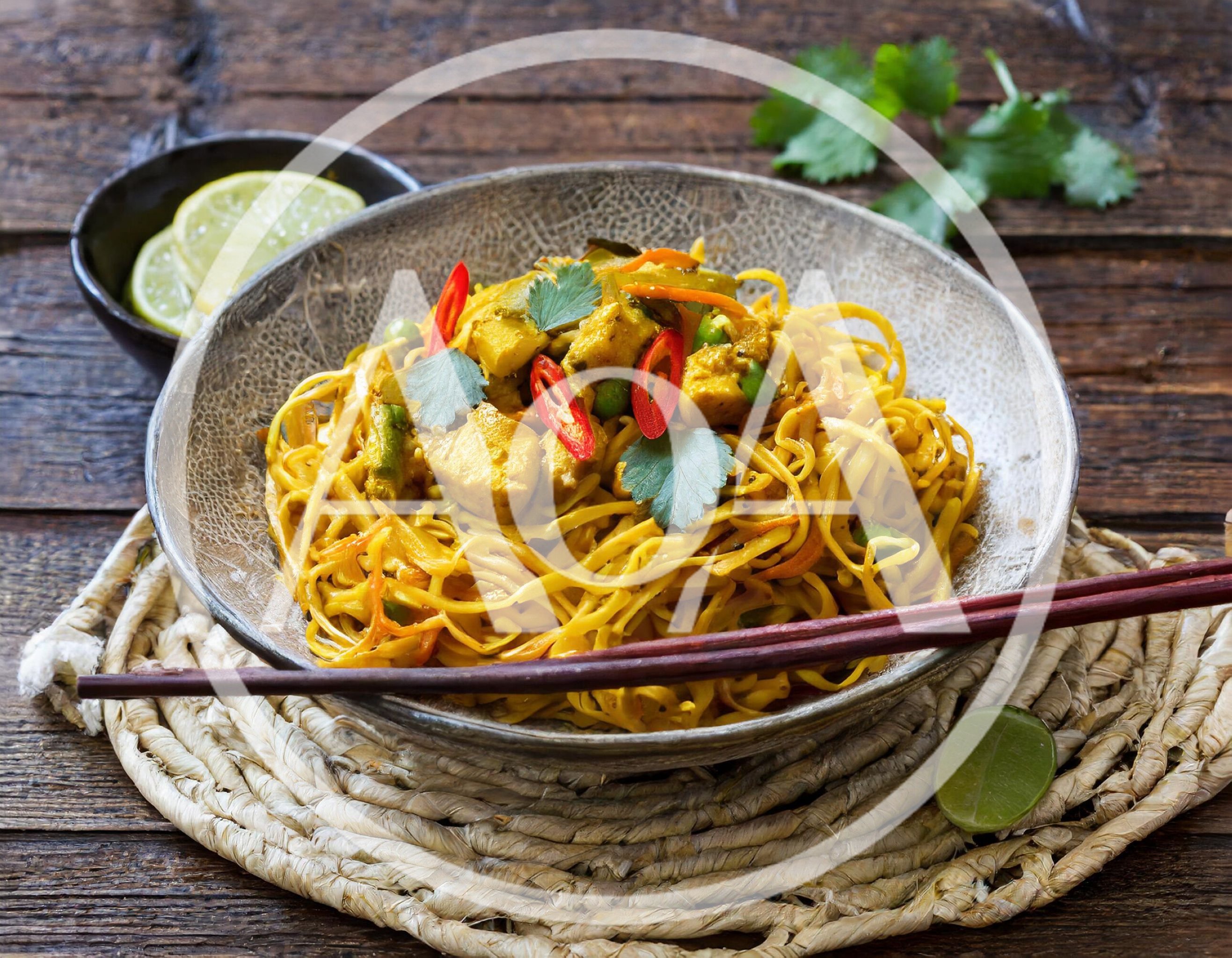 Bowl Of Curry Chicken Noodles With Fresh Chili