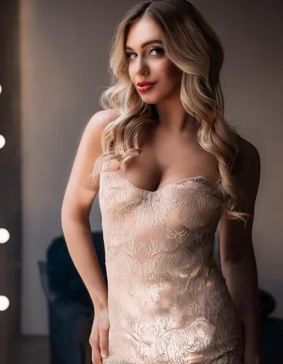 Portrait Of A Beautiful Blonde Woman In Evening Dress