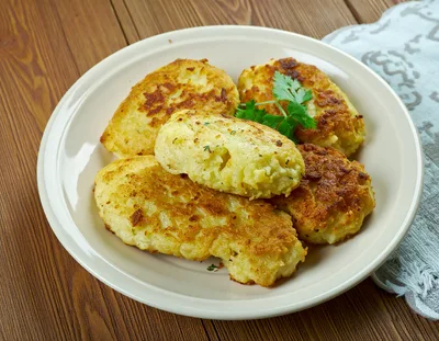 Homemade Potato Patties Served On A White Plate
