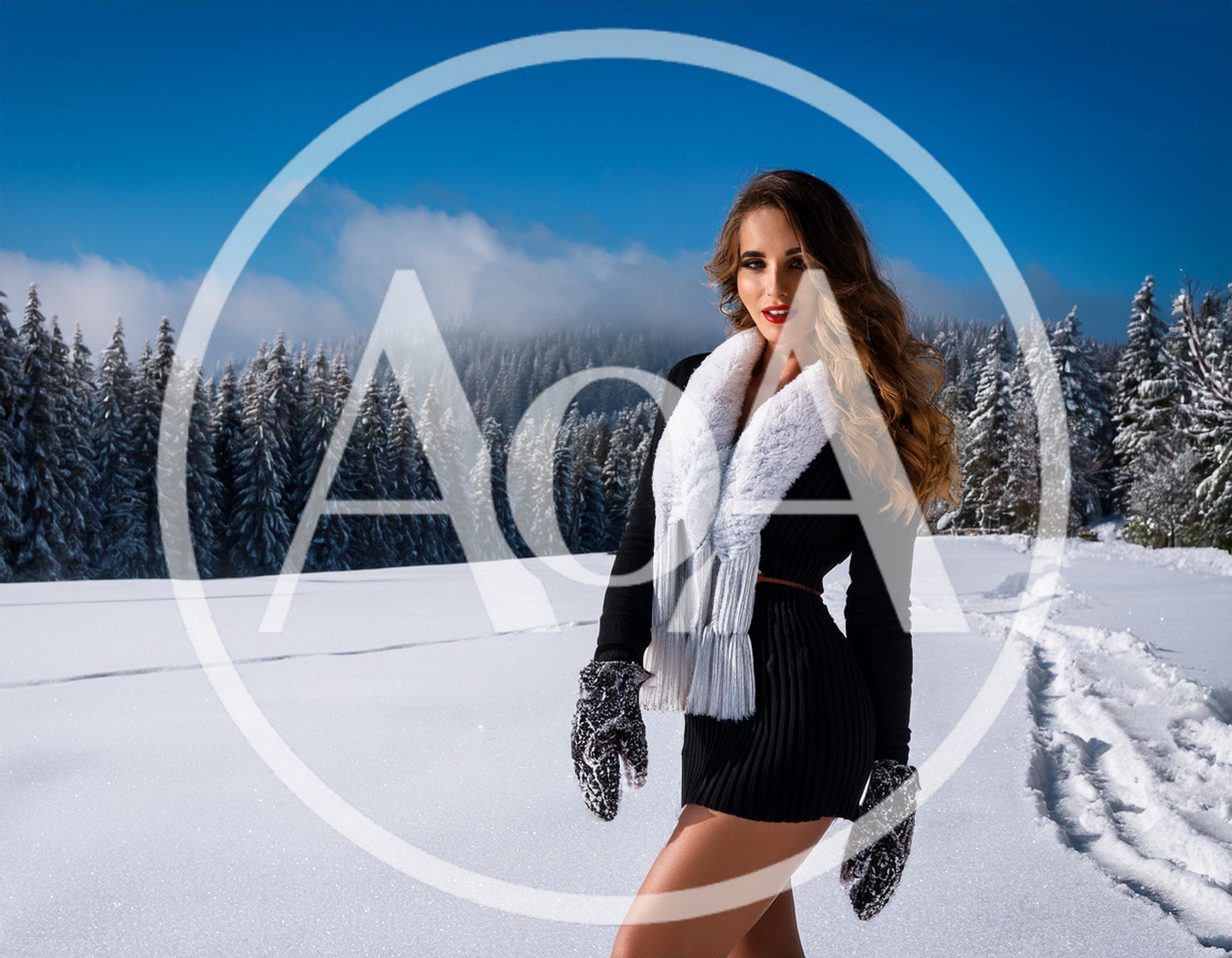 Fashionable Woman Posing In Snowy Mountain Landscape