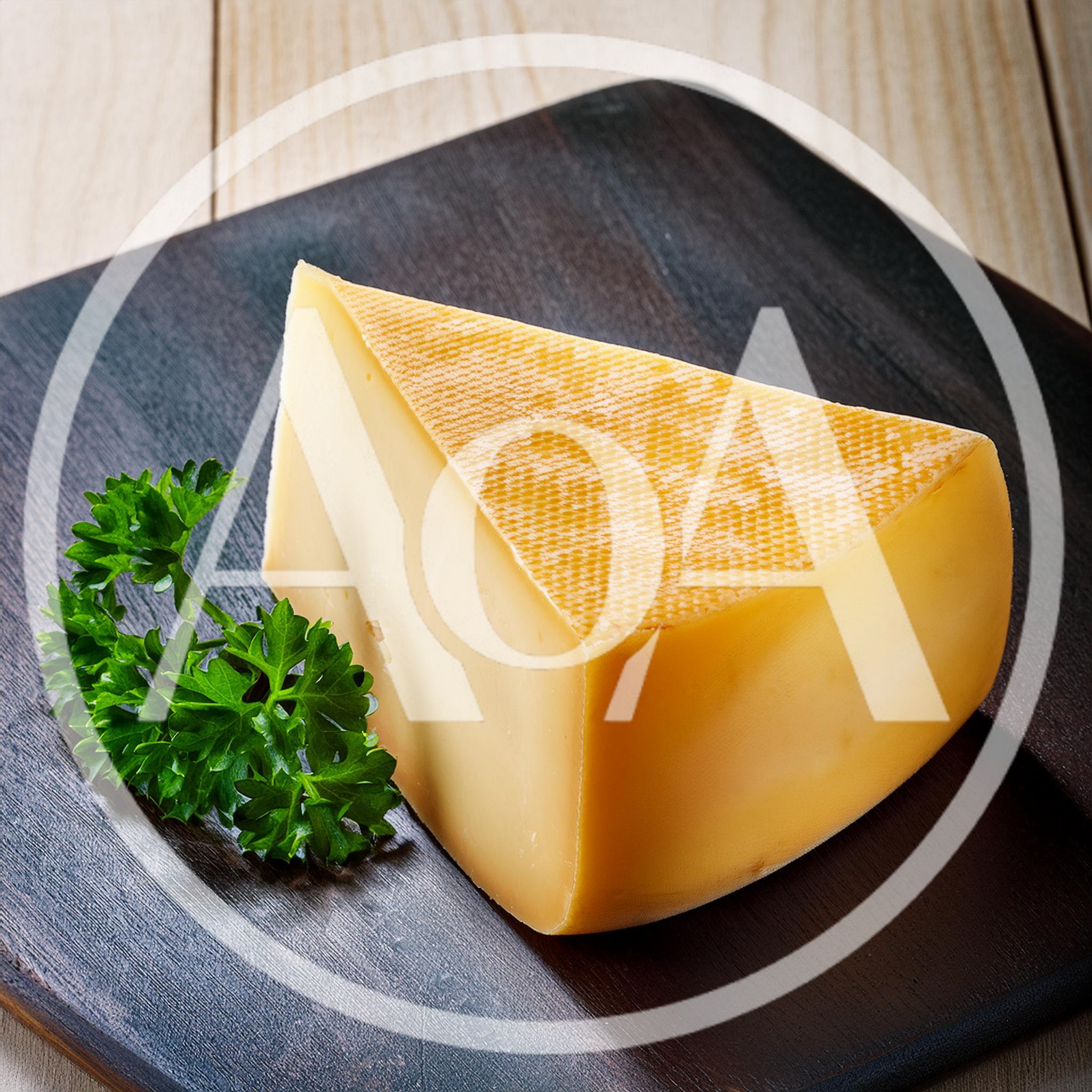Wedge of Aged Cheese on Dark Wooden Board
