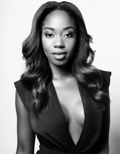 Portrait Of A Confident Young Woman In Black Blazer