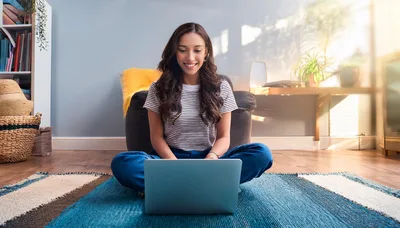 Young Woman Working On Laptop At Home