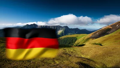 German Flag Waving Over A Scenic Mountain Landscape