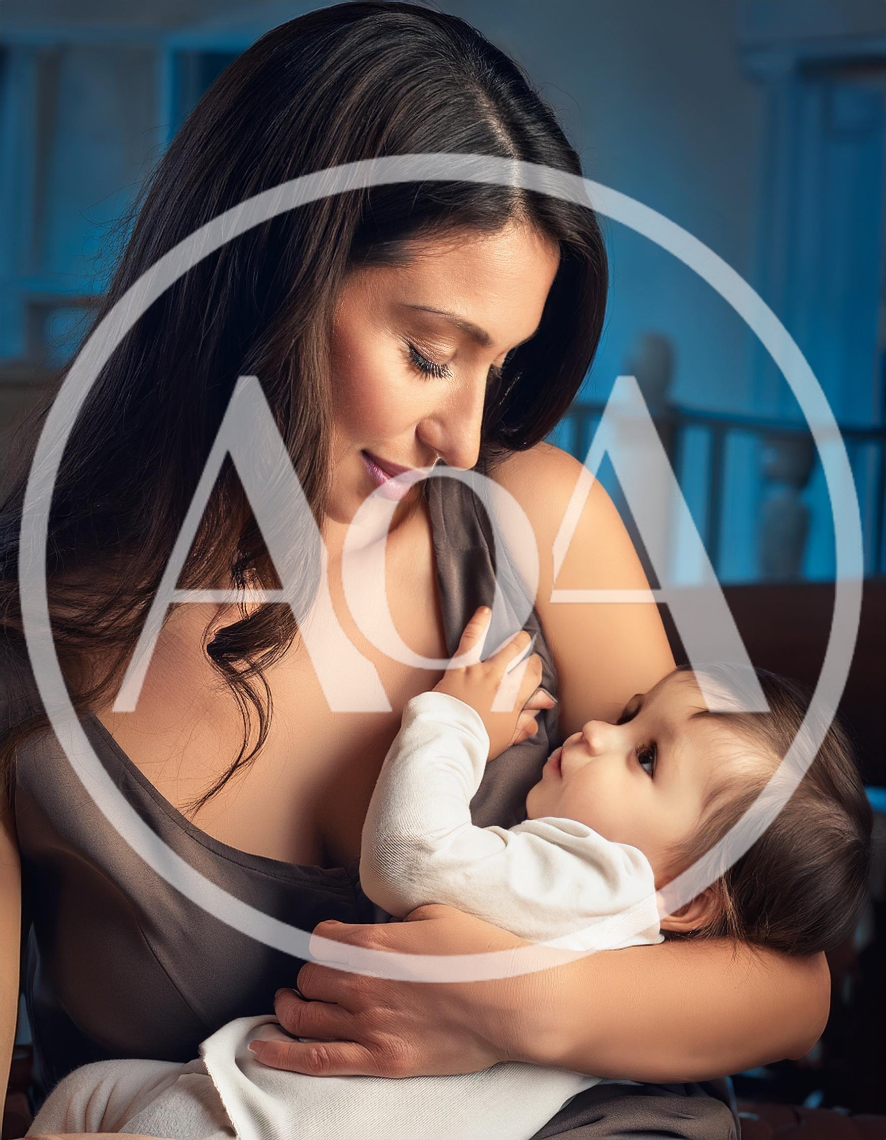 Mother Breastfeeding Her Baby In A Quiet Room