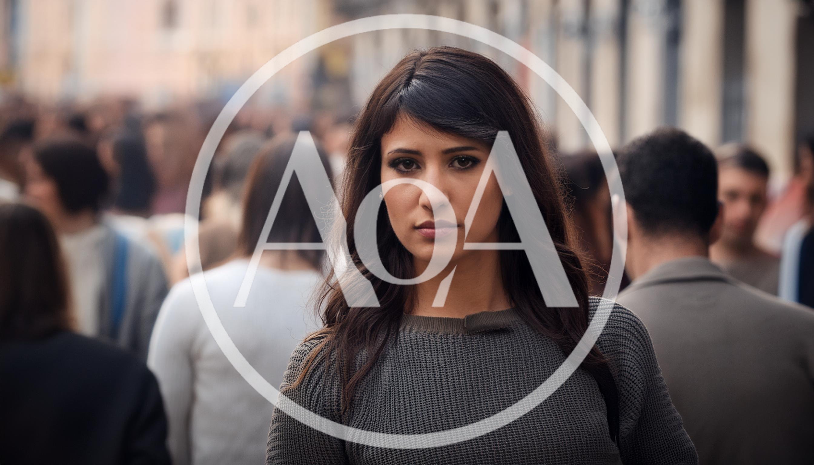 Young Woman Standing In A Crowded City Street