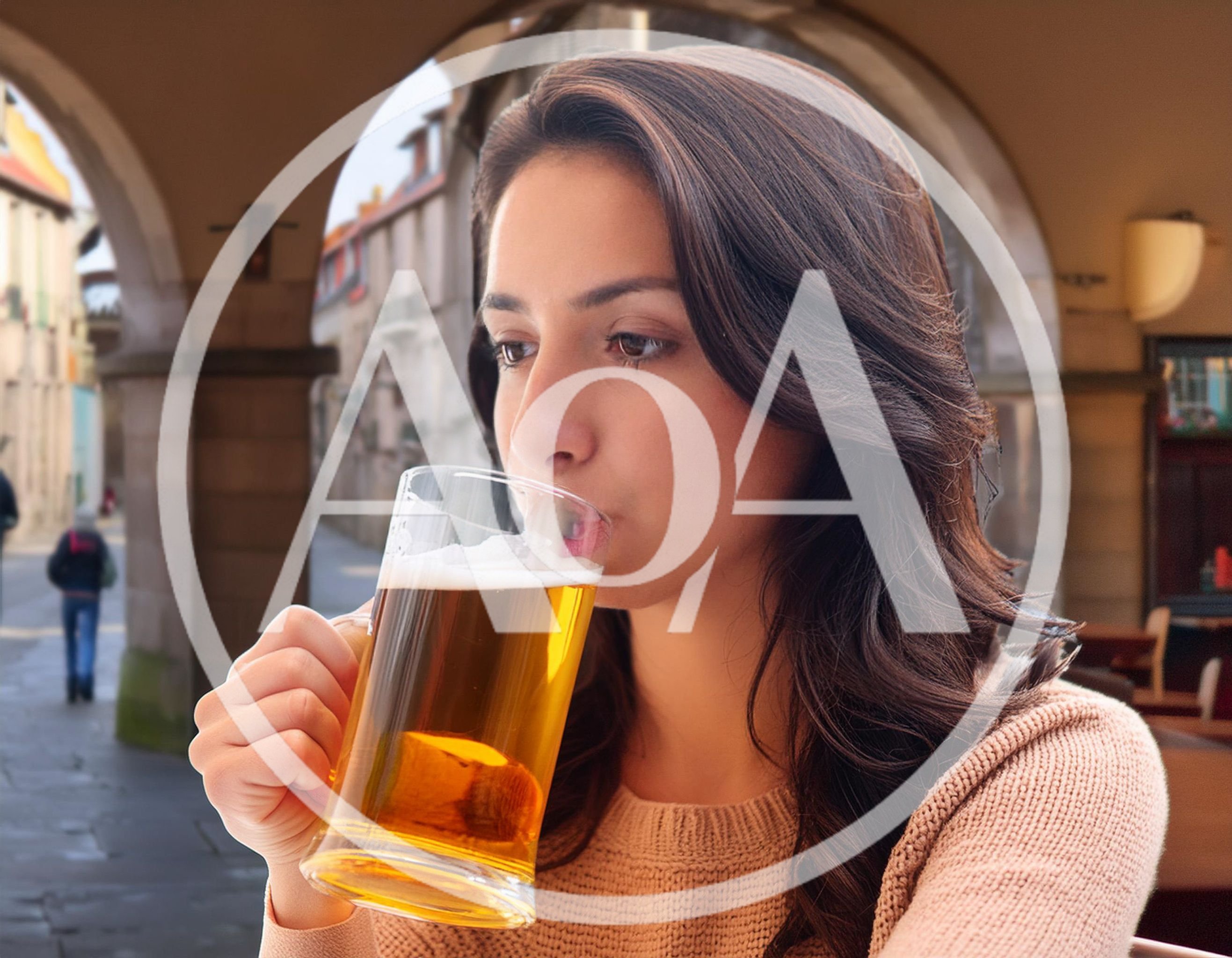 Young Woman Drinking Beer In A European Street Cafe