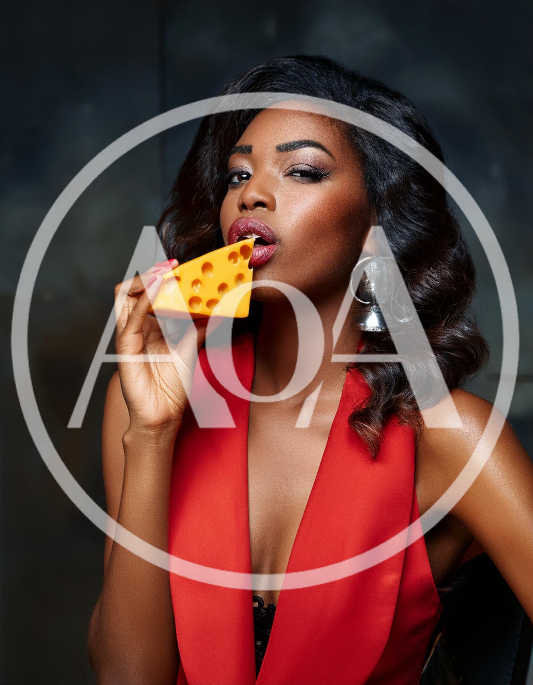 Elegant Woman Holding A Piece Of Swiss Cheese