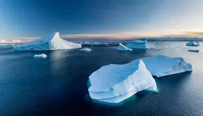 Aerial View Of Massive Icebergs Floating In Arctic Ocean
