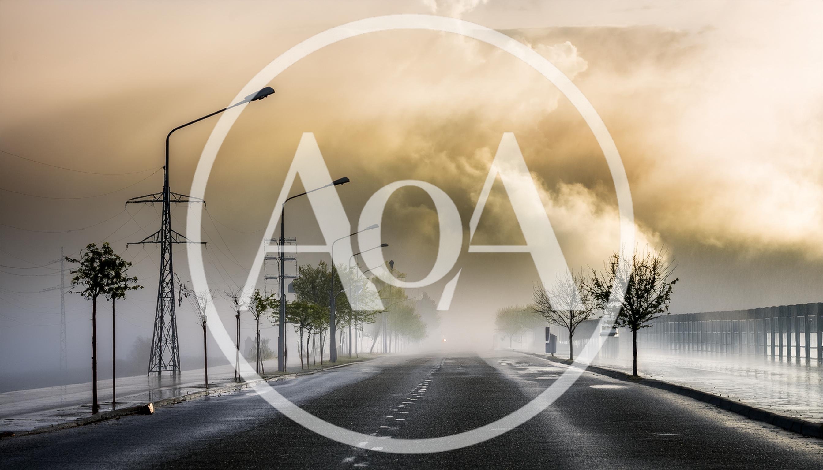 Empty Asphalt Road Under Dramatic Foggy Sky