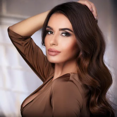 Portrait Of A Beautiful Woman With Wavy Brown Hair