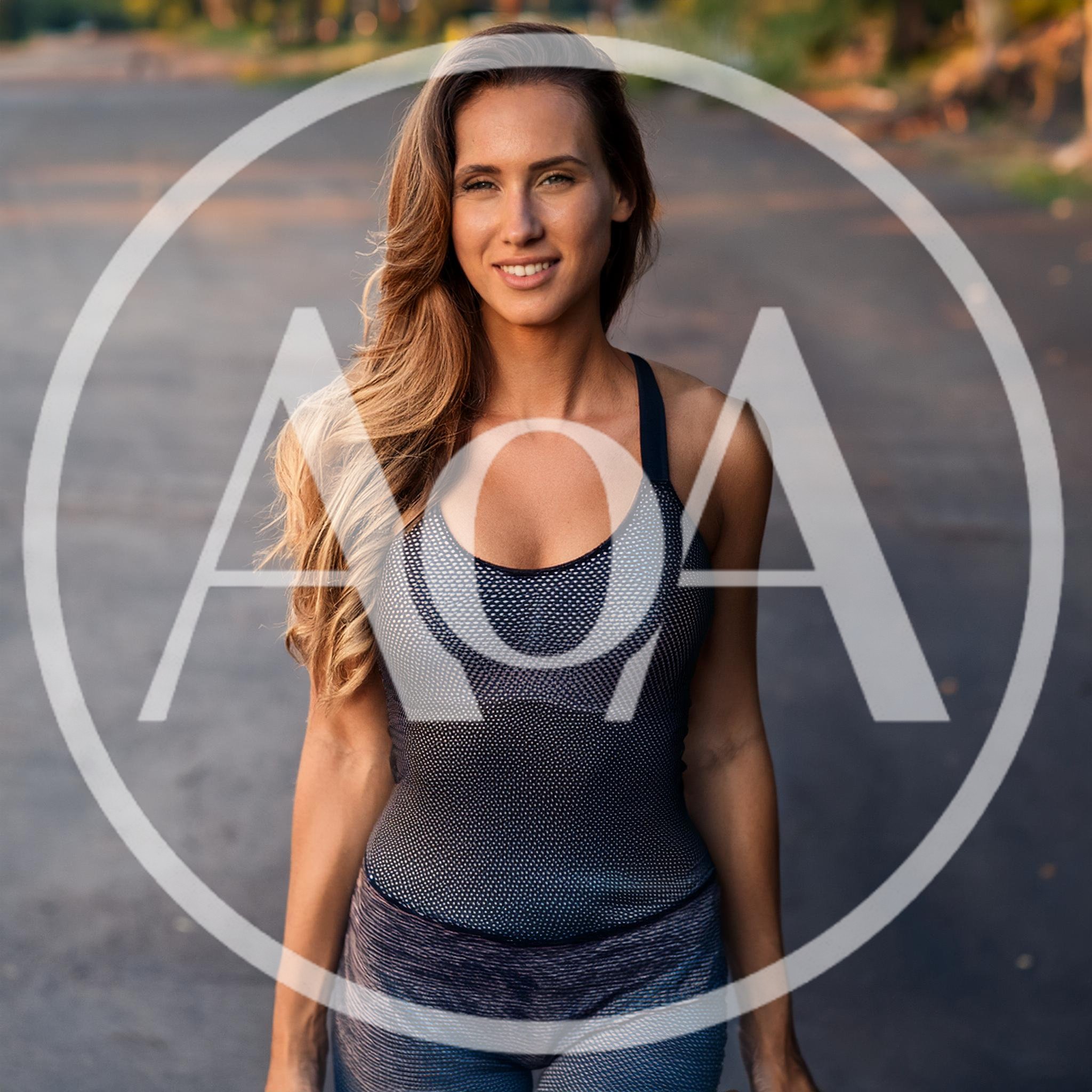 Fit Woman Standing Outdoors In Athletic Wear
