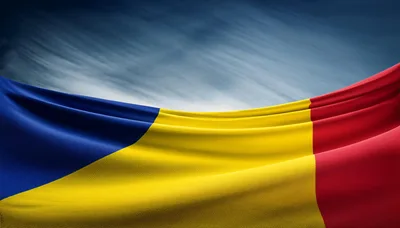 Waving Flag Of Romania Against A Dramatic Cloudy Sky