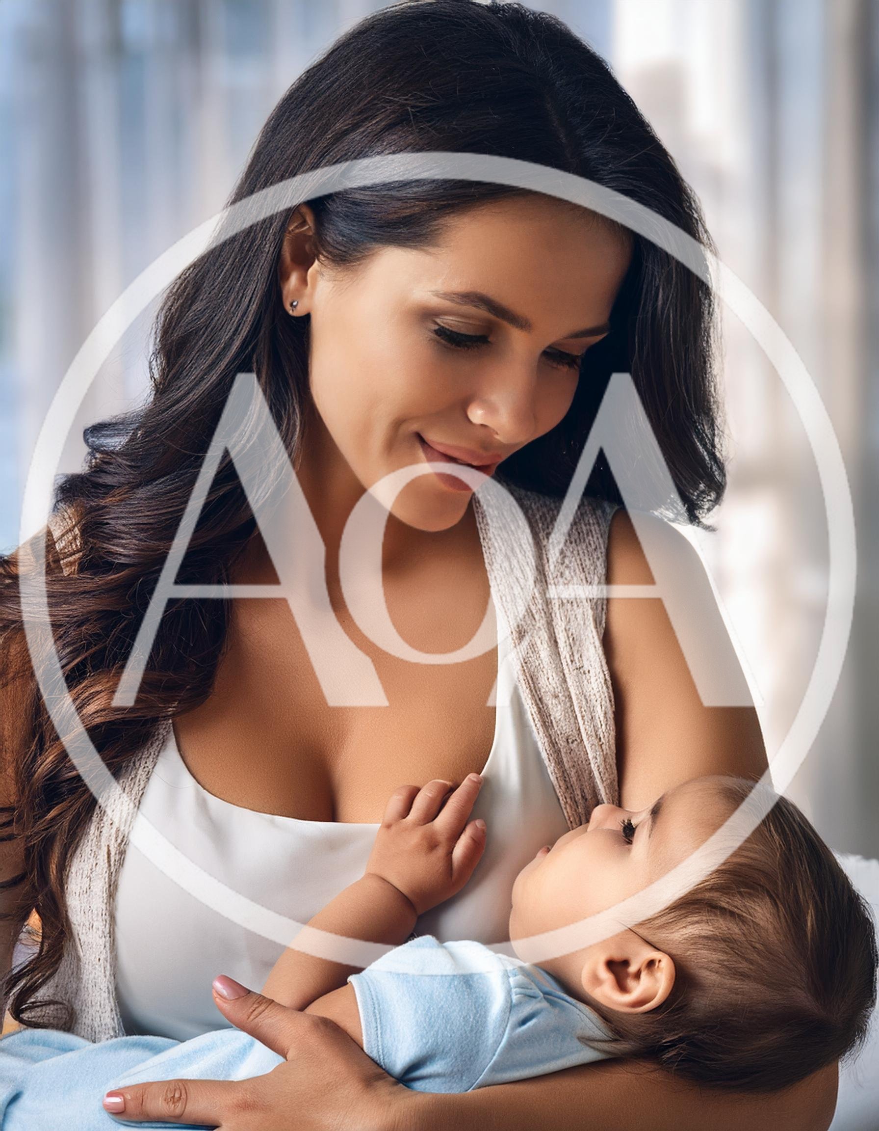 Mother Breastfeeding Her Baby In A Bright Room