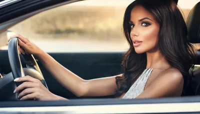 Beautiful Woman Driving A Luxury Car
