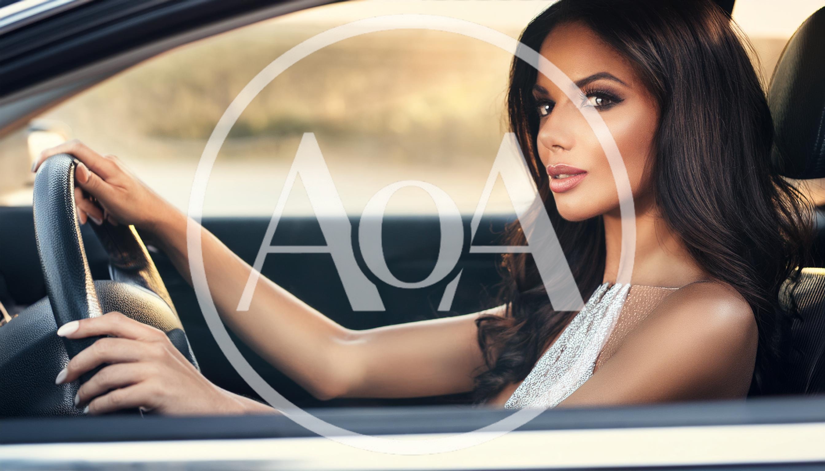 Beautiful Woman Driving A Luxury Car