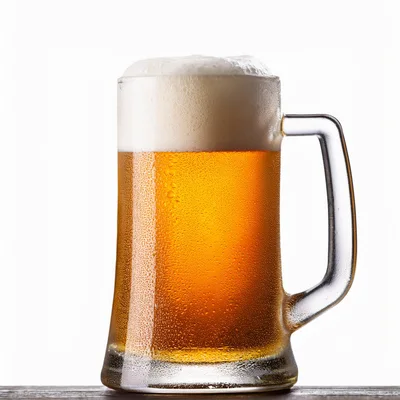 Cold Glass Mug Of Golden Beer With Frothy Head
