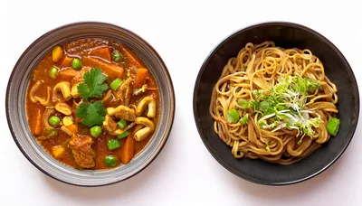 Two Bowls Of Asian Style Curry And Noodles