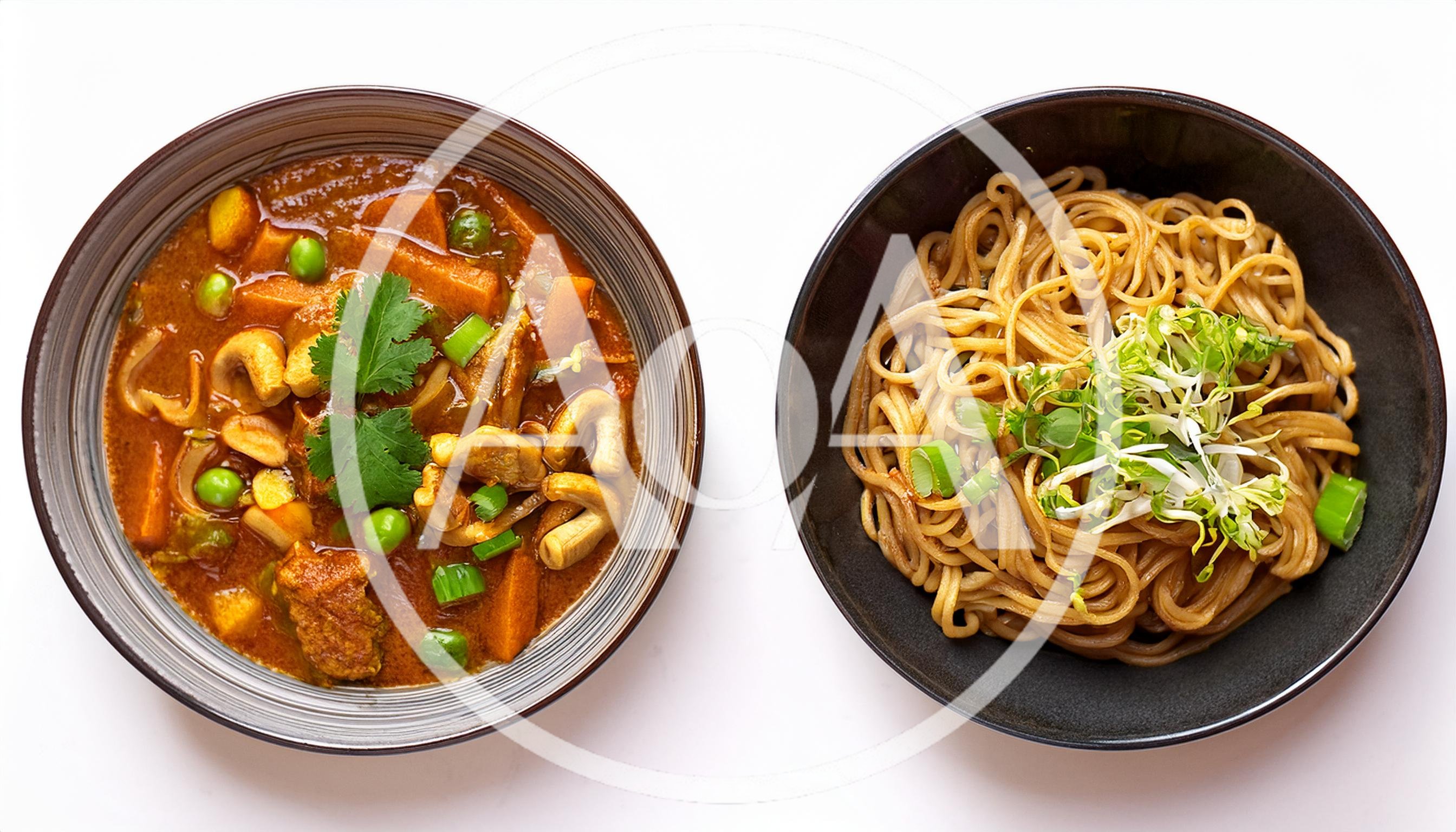 Two Bowls Of Asian Style Curry And Noodles