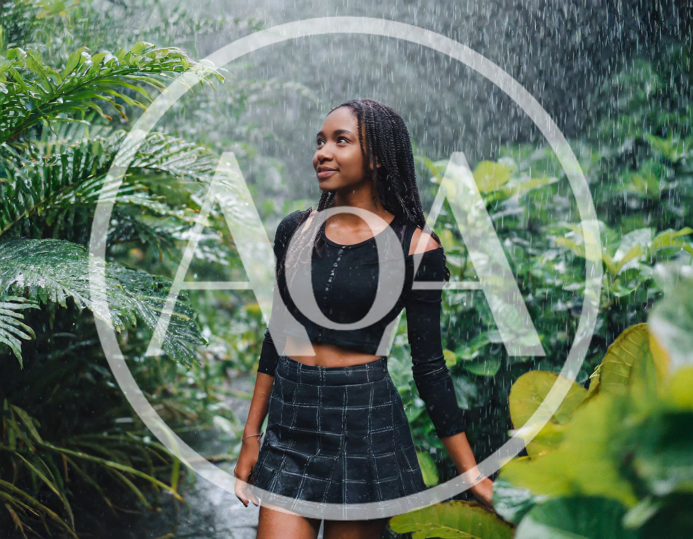 Young Woman Standing In Tropical Rain