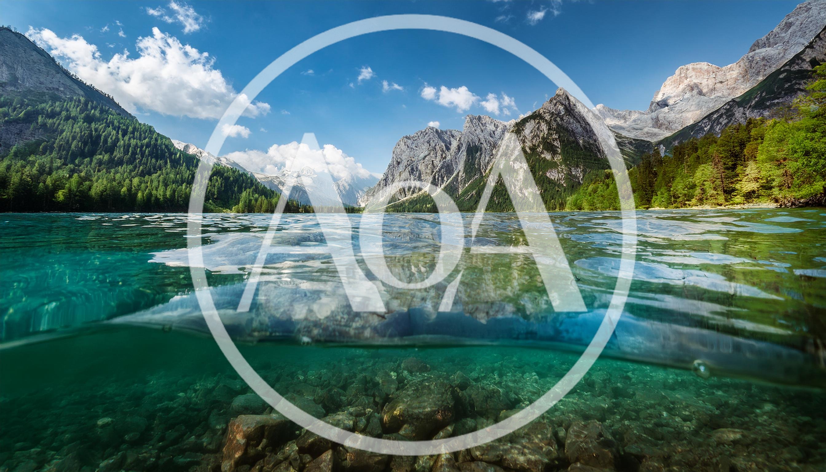Split Level View Of Alpine Lake And Mountains