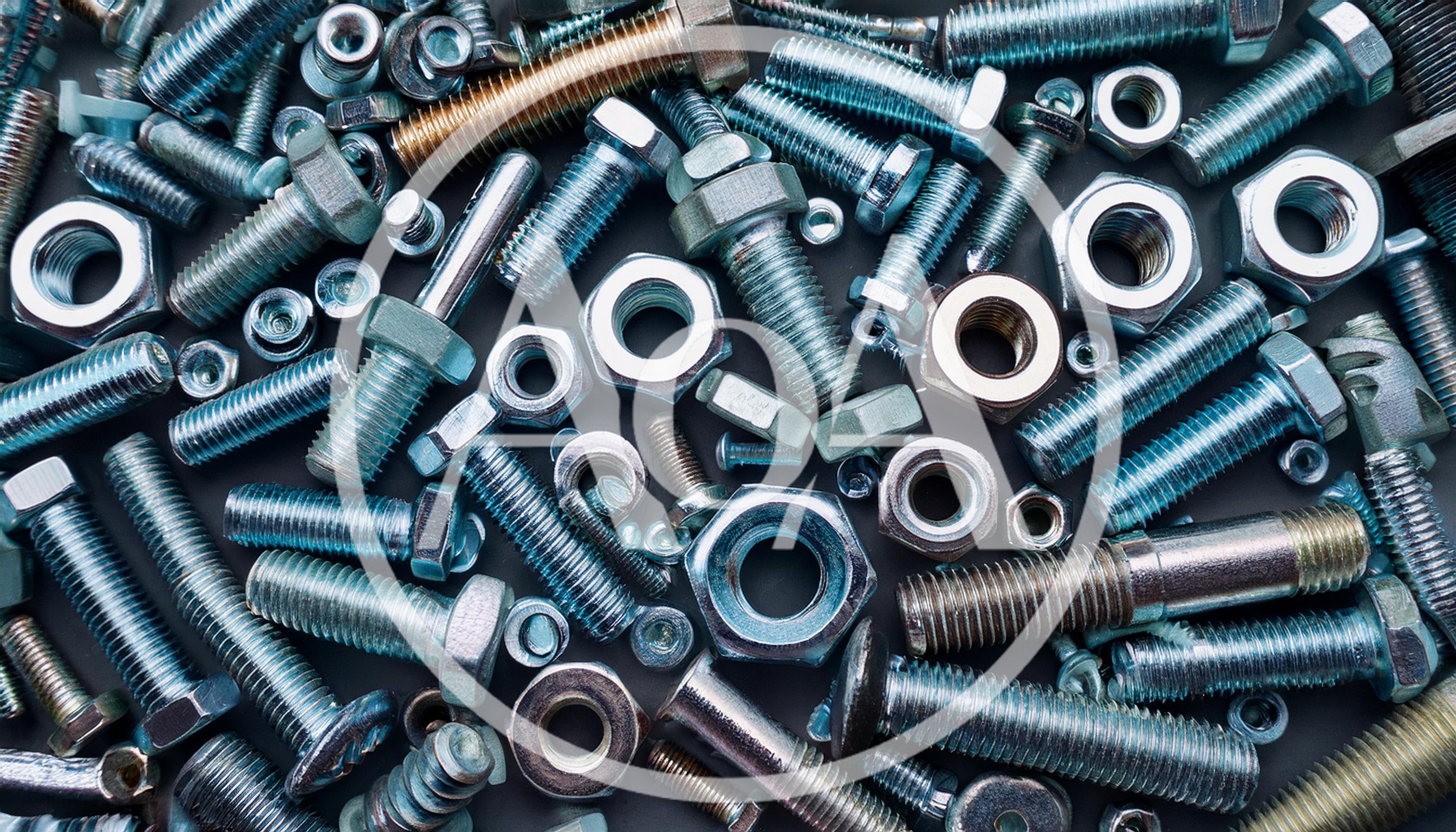 Assorted Metal Bolts and Nuts on Dark Background