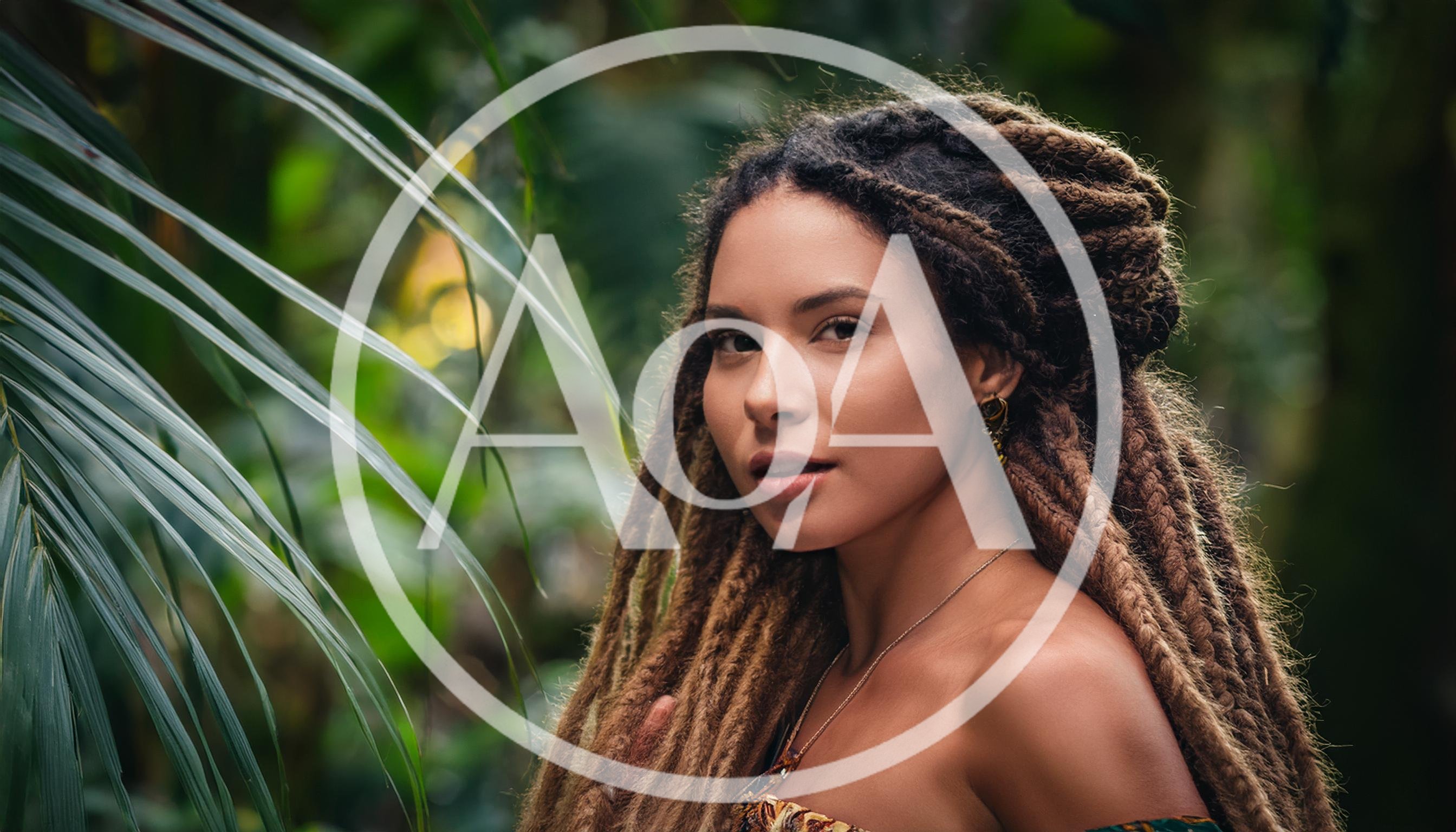 Young Woman With Dreadlocks Posing In Tropical Jungle